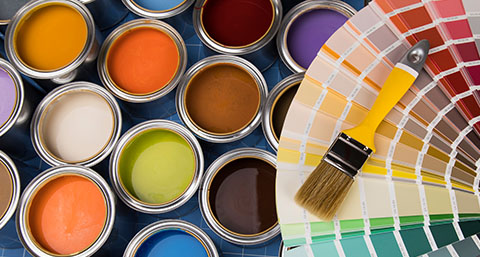 a number of different colours of paint in buckets, with a colour swatch and paint brush to the right